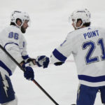 
              Tampa Bay Lightning center Brayden Point (21) congratulates right wing Nikita Kucherov (86) after Kucherov scored during the second period of an NHL hockey game against the Florida Panthers, Monday, Feb. 6, 2023, in Sunrise, Fla. (AP Photo/Wilfredo Lee)
            