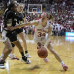 
              Indiana's Grace Berger (34) goes to the basket against Purdue's Jayla Smith (3) during the second half of an NCAA college basketball game, Sunday, Feb. 19, 2023, in Bloomington, Ind. (AP Photo/Darron Cummings)
            