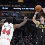 
              Charlotte Hornets' LaMelo Ball shoots as Chicago Bulls' Patrick Williams defends during the first half of an NBA basketball game Thursday, Feb. 2, 2023, in Chicago. (AP Photo/Charles Rex Arbogast)
            