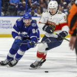 
              Tampa Bay Lightning's Tanner Jeannot and Florida Panthers' Anton Lundell compete for the puck during the second period of an NHL hockey game Tuesday, Feb. 28, 2023, in Tampa, Fla. (AP Photo/Mike Carlson)
            