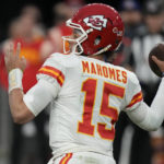 
              FILE - Kansas City Chiefs quarterback Patrick Mahomes (15) throws against the Las Vegas Raiders during the first half of an NFL football game, Wednesday, Jan. 11, 2023, in Las Vegas. The Chiefs and Eagles are bringing MVP finalists Patrick Mahomes and Jalen Hurts to the Super Bowl to cap a season in which the NFL had a glaring amount of instability at quarterback.(AP Photo/John Locher, File)
            