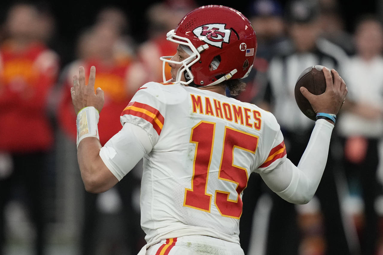 FILE - Kansas City Chiefs quarterback Patrick Mahomes (15) throws against the Las Vegas Raiders dur...