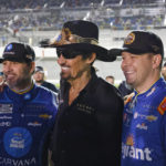 
              Former NASCAR driver Richard Petty, center, poses for a photo with Jimmie Johnson, left, and Erik Jones, right, before the first of two qualifying auto races for the NASCAR Daytona 500 at Daytona International Speedway, Thursday, Feb. 16, 2023, in Daytona Beach, Fla. (AP Photo/Terry Renna)
            