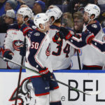 
              Columbus Blue Jackets left wing Eric Robinson (50) celebrates his goal during the first period of an NHL hockey game against the Buffalo Sabres, Tuesday, Feb. 28, 2023, in Buffalo, N.Y. (AP Photo/Jeffrey T. Barnes)
            