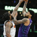 
              Charlotte Hornets center Nick Richards, right, shoots against Denver Nuggets center DeAndre Jordan during the first half of an NBA basketball game in Charlotte, N.C., Saturday, Feb. 11, 2023. (AP Photo/Nell Redmond)
            