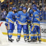 
              St. Louis Blues' Sammy Blais, center, is congratulated by teammates after scoring against the Colorado Avalanche during the second period of an NHL hockey game Saturday, Feb. 18, 2023, in St. Louis. (AP Photo/Scott Kane)
            