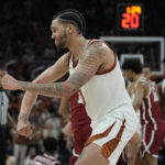 
              Texas forward Timmy Allen (0) celebrates a play against Oklahoma during overtime of an NCAA college basketball game in Austin, Texas, Saturday, Feb. 18, 2023. (AP Photo/Eric Gay)
            