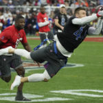 
              NFC fullback Kyle Juszczyk of the San Francisco 49ers makes a catch as AFC middle linebacker Roquan Smith (18) of the Baltimore Ravens defends during the flag football event at the NFL Pro Bowl, Sunday, Feb. 5, 2023, in Las Vegas. (AP Photo/John Locher)
            
