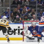 
              Pittsburgh Penguins right wing Rickard Rakell (67) scores a goal past New York Islanders goaltender Ilya Sorokin (30) during the second period of an NHL hockey game Friday, Feb. 17, 2023, in Elmont, N.Y. (AP Photo/Mary Altaffer)
            