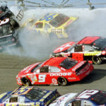 
              FILE - In this Feb. 18, 2001, file photo, Dale Earnhardt's (3) window pops out of the car after being hit by Ken Schrader (36) during the Daytona 500 auto race at Daytona International Speedway in Daytona Beach, Fla. NASCAR’s next 75 years almost certainly will include at least a partially electric vehicle turning laps at Daytona International Speedway. It’s unfathomable to some, unconscionable to others. (AP Photo/Greg Suvino, File)
            