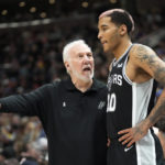 
              San Antonio Spurs head coach Gregg Popovich speaks with Jeremy Sochan (10) during the first half of an NBA basketball game against the Utah Jazz Tuesday, Feb. 28, 2023, in Salt Lake City. (AP Photo/Rick Bowmer)
            
