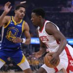 
              Houston Rockets guard Jae'Sean Tate, right, drives to the basket while defended by Golden State Warriors guard Jordan Poole during the first half of an NBA basketball game in San Francisco, Friday, Feb. 24, 2023. (AP Photo/Godofredo A. Vásquez)
            