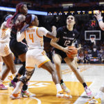 
              South Carolina guard Brea Beal (12) drives as she is defended by Tennessee guard Jordan Walker (4) during the second half of an NCAA college basketball game, Thursday, Feb. 23, 2023, in Knoxville, Tenn. (AP Photo/Wade Payne)
            