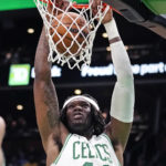 
              Boston Celtics center Robert Williams III (44) slams a dunk against the Brooklyn Nets during the first half of an NBA basketball game, Wednesday, Feb. 1, 2023, in Boston. (AP Photo/Charles Krupa)
            