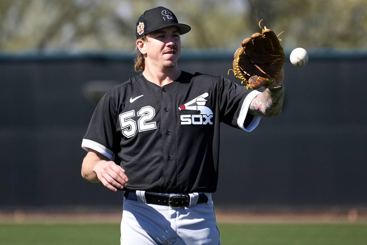 Chicago White Sox starting pitcher Mike Clevinger (52) works out during a spring training baseball ...