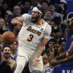 
              Los Angeles Lakers forward Anthony Davis (3) reacts after scoring on a slam dunk against the Dallas Mavericks during the fourth quarter of an NBA basketball game in Dallas, Sunday, Feb. 26, 2023. (AP Photo/LM Otero)
            