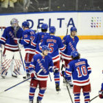 
              New York Rangers goaltender Igor Shesterkin, left, celebrates with teammates after an NHL hockey game against the Vancouver Canucks Wednesday, Feb. 8, 2023, in New York. The Rangers won 4-3. (AP Photo/Frank Franklin II)
            