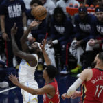 
              Los Angeles Lakers guard Patrick Beverley (21) goes to the basket over New Orleans Pelicans guard Trey Murphy III and center Jonas Valanciunas (17) in the first half of an NBA basketball game in New Orleans, Saturday, Feb. 4, 2023. (AP Photo/Gerald Herbert)
            