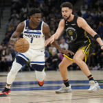 
              Minnesota Timberwolves guard Anthony Edwards (1) works towards the basket while defended by Golden State Warriors guard Klay Thompson (11) during the first half of an NBA basketball game, Wednesday, Feb. 1, 2023, in Minneapolis. (AP Photo/Abbie Parr)
            