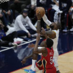 
              Los Angeles Lakers forward LeBron James (6)goes to the basket against New Orleans Pelicans forward Herbert Jones (5) in the first half of an NBA basketball game in New Orleans, Saturday, Feb. 4, 2023. (AP Photo/Gerald Herbert)
            
