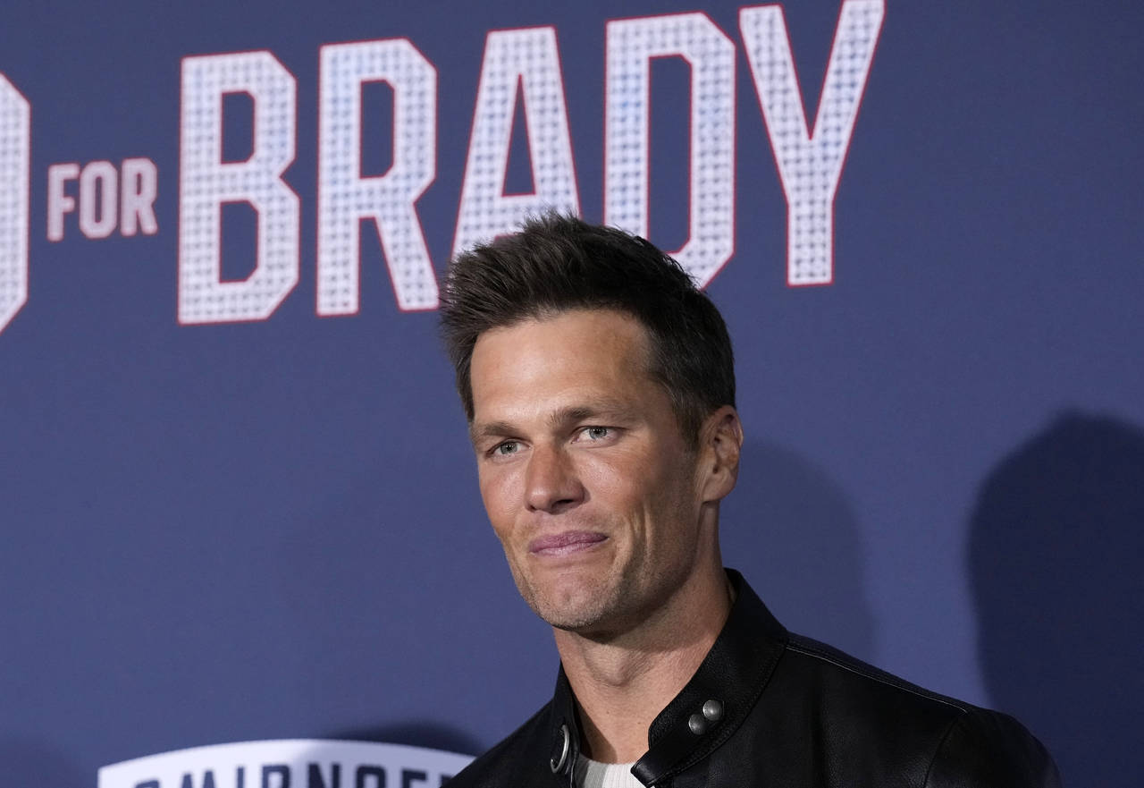 NFL quarterback Tom Brady, a cast member and producer of "80 for Brady," poses at the premiere of t...