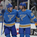 
              St. Louis Blues' Brandon Saad (20) is congratulated by Pavel Buchnevich after scoring during the second period of an NHL hockey game against the Arizona Coyotes Saturday, Feb. 11, 2023, in St. Louis. (AP Photo/Jeff Roberson)
            