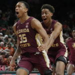 
              Florida State guard Matthew Cleveland (35), right, reacts after scoring the winning basket during the second half of an NCAA college basketball game against Miami, Saturday, Feb. 25, 2023, in Coral Gables, Fla. Florida State defeated Miami 85-84. (AP Photo/Marta Lavandier)
            