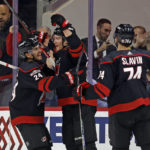 
              Carolina Hurricanes' Andrei Svechnikov, center, celebrates his goal with teammates Seth Jarvis (24) and Jaccob Slavin (74) during the first period of an NHL hockey game against the St. Louis Blues in Raleigh, N.C., Tuesday, Feb. 21, 2023. (AP Photo/Karl B DeBlaker)
            