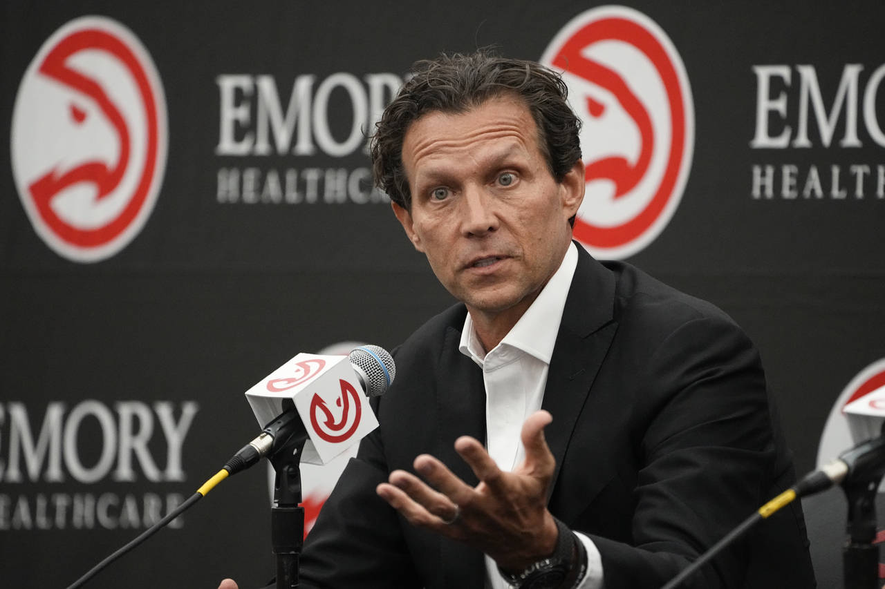 Newly hired Atlanta Hawks NBA basketball coach Quin Snyder speaks during a news conference Monday, ...