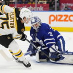 
              Boston Bruins' Connor Clifton (75) is stopped by Toronto Maple Leafs' goaltender Ilya Samsonov (35) during the first period of an NHL hockey game, Wednesday, Feb.1, 2023 in Toronto. (Frank Gunn/The Canadian Press via AP)
            