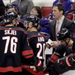 
              Carolina Hurricanes coach Rod Brind'Amour talks with player during a break in the action in the third period of the team's NHL hockey game against the New York Rangers, Saturday, Feb. 11, 2023, in Raleigh, N.C. (AP Photo/Chris Seward)
            