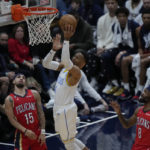 
              Los Angeles Lakers guard Russell Westbrook (0) goes to the basket between New Orleans Pelicans guard Jose Alvarado (15) and forward Naji Marshall (8) in the first half of an NBA basketball game in New Orleans, Saturday, Feb. 4, 2023. (AP Photo/Gerald Herbert)
            