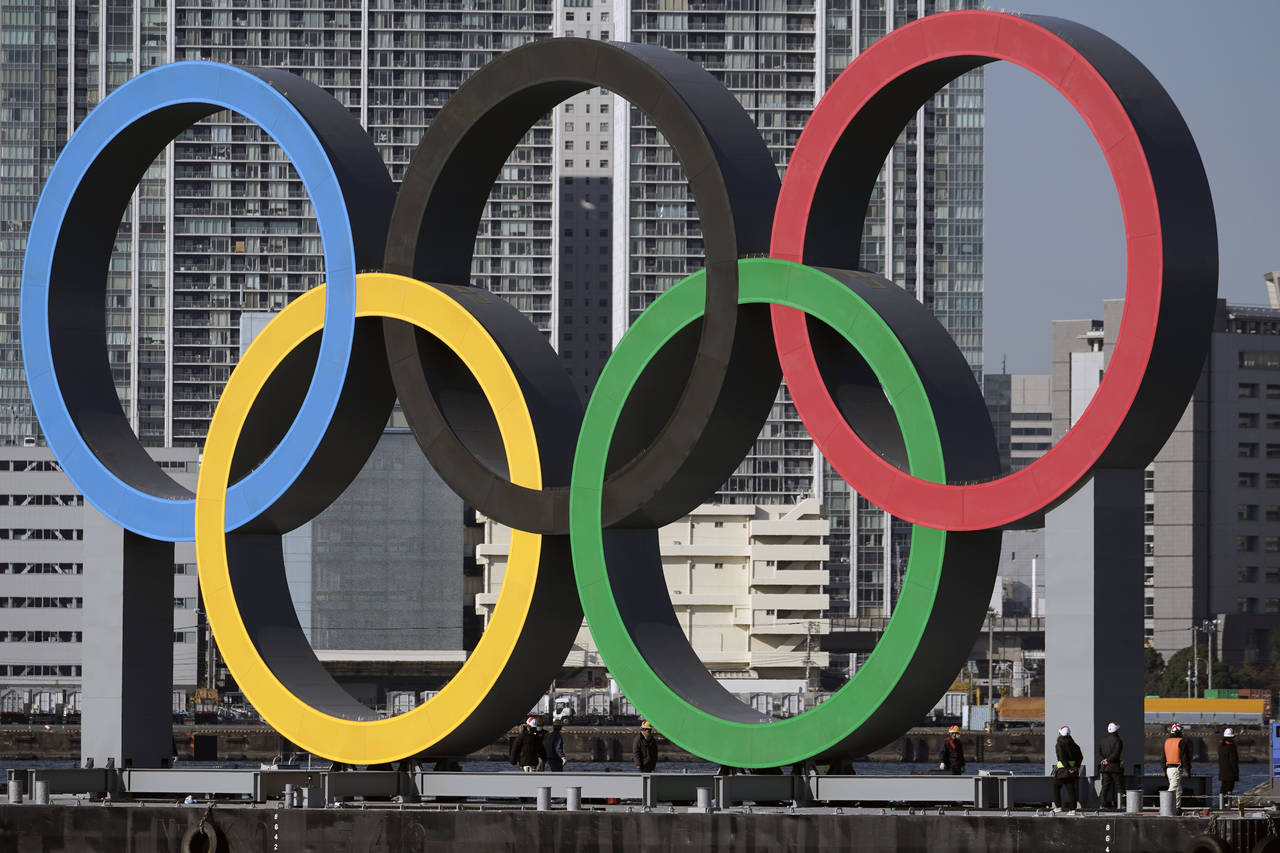 FILE - In this Dec. 1, 2020, file photo, the Olympic rings are reinstalled after it was taken down ...