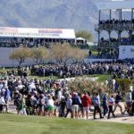 
              Golf fans make their way around the course during the second round of the Phoenix Open golf tournament Friday Feb. 10, 2023, in Scottsdale, Ariz. (AP Photo/Darryl Webb)
            