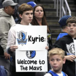 
              A young fans holds up a sign for Dallas Mavericks guard Kyrie Irving prior to an NBA basketball game against the Los Angeles Clippers Wednesday, Feb. 8, 2023, in Los Angeles. (AP Photo/Mark J. Terrill)
            