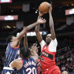 
              Toronto Raptors forward Chris Boucher, right, grabs a rebound from Houston Rockets forward Tari Eason, left, during the first half of an NBA basketball game, Friday, Feb. 3, 2023, in Houston. (AP Photo/Eric Christian Smith)
            