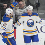 
              Buffalo Sabres center Tyson Jost (17) celebrates with left wing Zemgus Girgensons (28) after scoring during the first period of an NHL hockey game against the Anaheim Ducks in Anaheim, Calif., Wednesday, Feb. 15, 2023. (AP Photo/Ashley Landis)
            