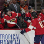 
              Florida Panthers defenseman Marc Staal (18) is congratulated by his teammates after scoring a goal against the San Jose Sharks during the second period of a NHL game, Monday, Feb. 20, 2023, in Sunrise, Fla. (AP Photo/Marta Lavandier)
            