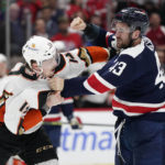 
              Washington Capitals right wing Tom Wilson, right, swings at Anaheim Ducks defenseman Simon Benoit during a fight in the second period of an NHL hockey game, Thursday, Feb. 23, 2023, in Washington. (AP Photo/Patrick Semansky)
            