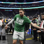 
              Boston Celtics forward Blake Griffin greets fans after the second half of an NBA basketball game against the Detroit Pistons, Monday, Feb. 6, 2023, in Detroit. (AP Photo/Carlos Osorio)
            
