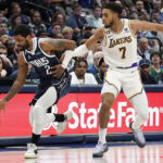 
              Dallas Mavericks guard Kyrie Irving (2) dribbles against Los Angeles Lakers forward Troy Brown Jr. (7) during the first quarter of an NBA basketball game in Dallas, Sunday, Feb. 26, 2023. (AP Photo/LM Otero)
            
