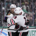 
              Chicago Blackhawks' Patrick Kane (88) and Max Domi (13) celebrate after Domi scored off an assist from Kane in the second period of an NHL hockey game against the Dallas Stars, Wednesday, Feb. 22, 2023, in Dallas. (AP Photo/Tony Gutierrez)
            