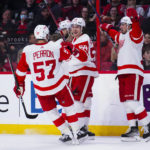 
              Detroit Red Wings left wing Tyler Bertuzzi (59) celebrates after his goal against the Ottawa Senators with teammates during first-period NHL hockey game action in Ottawa, Ontario, Monday, Feb. 27, 2023. (Sean Kilpatrick/The Canadian Press via AP)
            