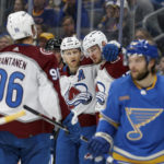 
              Colorado Avalanche's Valeri Nichushkin , second from right, is congratulated by teammates after scoring against the St. Louis Blues during the third period of an NHL hockey game Saturday, Feb. 18, 2023, in St. Louis. (AP Photo/Scott Kane)
            