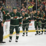 
              Minnesota Wild left wing Kirill Kaprizov, left, celebrates with the bench after scoring against the Florida Panthers during the second period of an NHL hockey game Monday, Feb. 13, 2023, in St. Paul, Minn. (AP Photo/Craig Lassig)
            