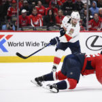 
              Florida Panthers center Aleksander Barkov (16) shoots the puck past Washington Capitals defenseman Dylan McIlrath (25) during the second period of an NHL hockey game Thursday, Feb. 16, 2023, in Washington. (AP Photo/Nick Wass)
            