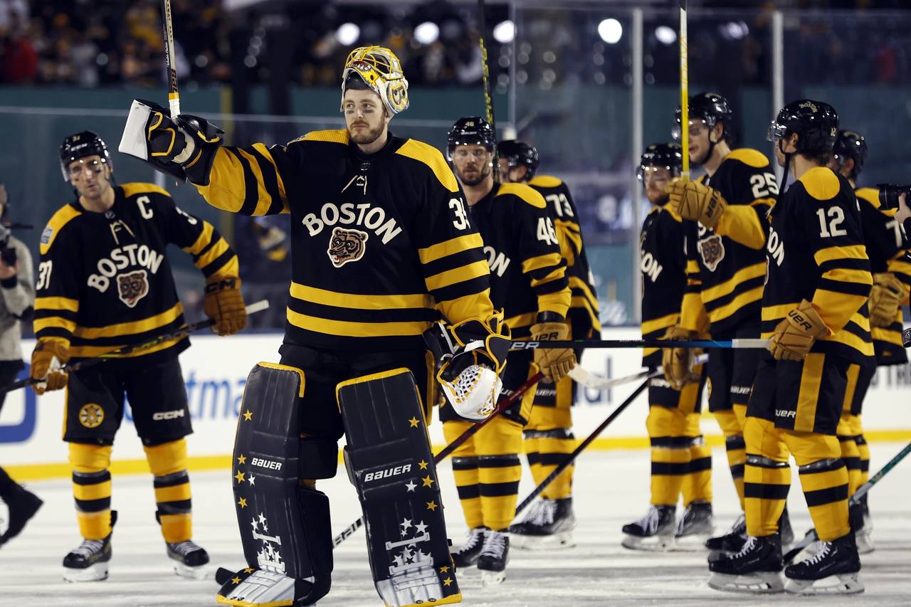 FILE - Boston Bruins' Linus Ullmark (35) and teammates celebrate after defeating the Pittsburgh Pen...