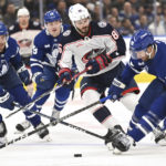 
              Toronto Maple Leafs defenceman T. J. Brodie (78) controls the puck against Columbus Blue Jackets right winger Kirill Marchenko (86) during the first period of an NHL hockey game Saturday, Feb. 11, 2023, in Toronto. (Jon Blacker/The Canadian Press via AP)
            