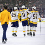 
              Nashville Predators' Filip Forsberg (9) is helped off the ice by teammates Matt Duchene (95) and Dante Fabbro (57) after an injury during the first period an NHL hockey game against the Philadelphia Flyers, Saturday, Feb. 11, 2023, in Philadelphia. (AP Photo/Derik Hamilton)
            