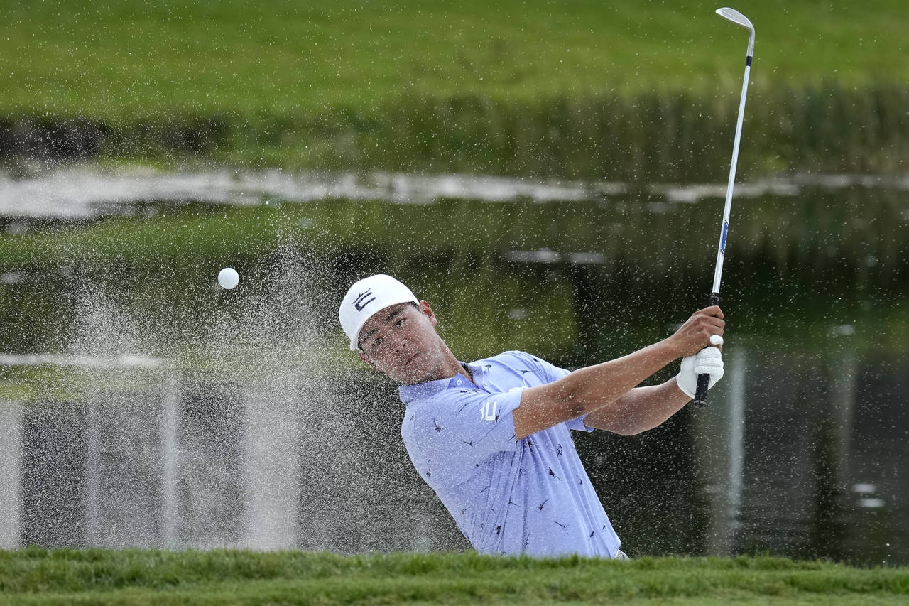 Justin Suh hits onto the 16th green during the second round of the Honda Classic golf tournament, F...